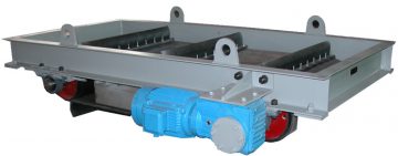 A metal industrial conveyor mechanism, featuring a blue electric motor attached to a gray frame, is designed for transporting items on rollers in manufacturing or processing environments.